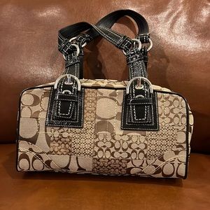 Coach purse brown canvass and black patten seems and straps